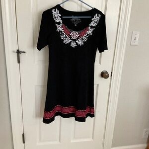 Petite small black shortsleeved dress with orange, pink, and white detailing